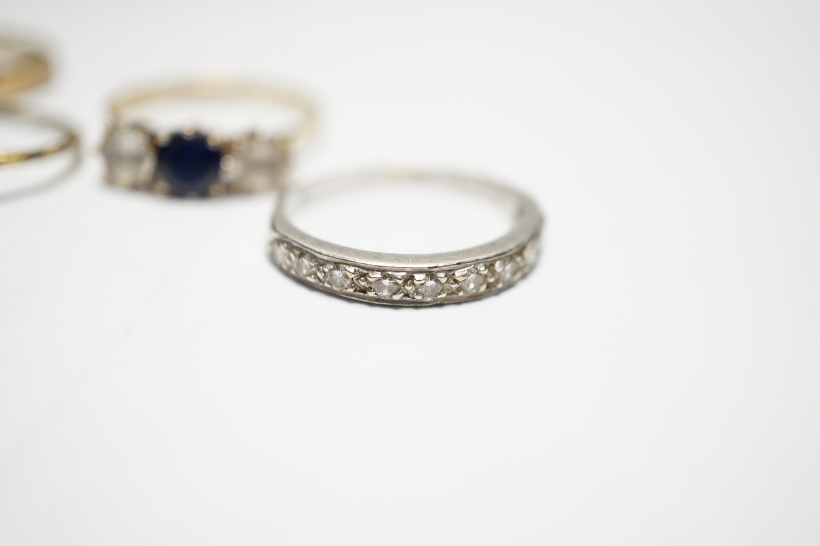 Two 9ct and gem set rings, including diamond chip half eternity and two other rings.